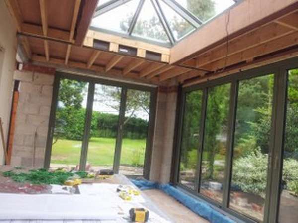 Mr B, Henbury, Cheshire : Internal view of Orangery designed by FOB Architects Installation of Centor C1 Bi-fold doors with triple glazing and sprayed in RAL 7033 paint. Installation off an Aluminium spared ATS roof system with electric opening vents.