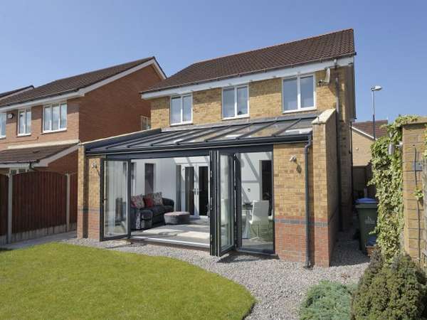 Warrington : Mr & Mrs D . Design and Build : Ultra Aluminium Capped roof system to Ral 5008 - Glazed with Celsius on roof glass Ug 1 . Bi Fold doors - Centor C1t Triple glazed with 44mm sealed units Ug .75